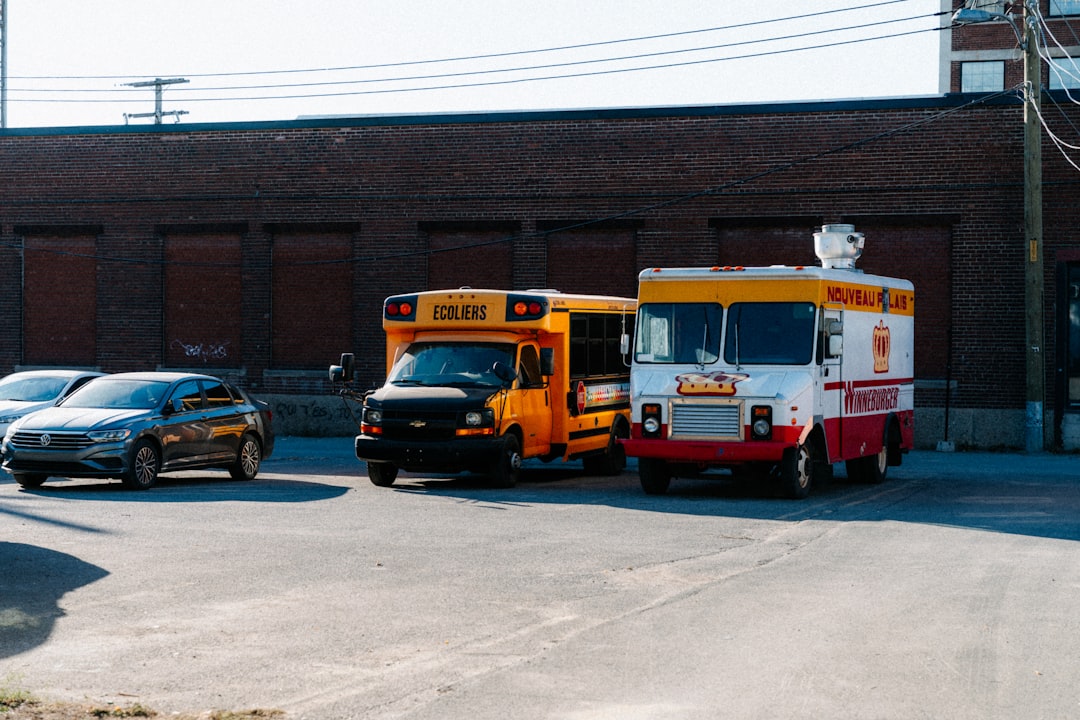 Fleet of HVAC service vans parked at a company facility