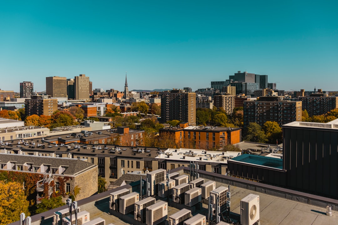 Aerial view of suburban commercial district with HVAC units on rooftops