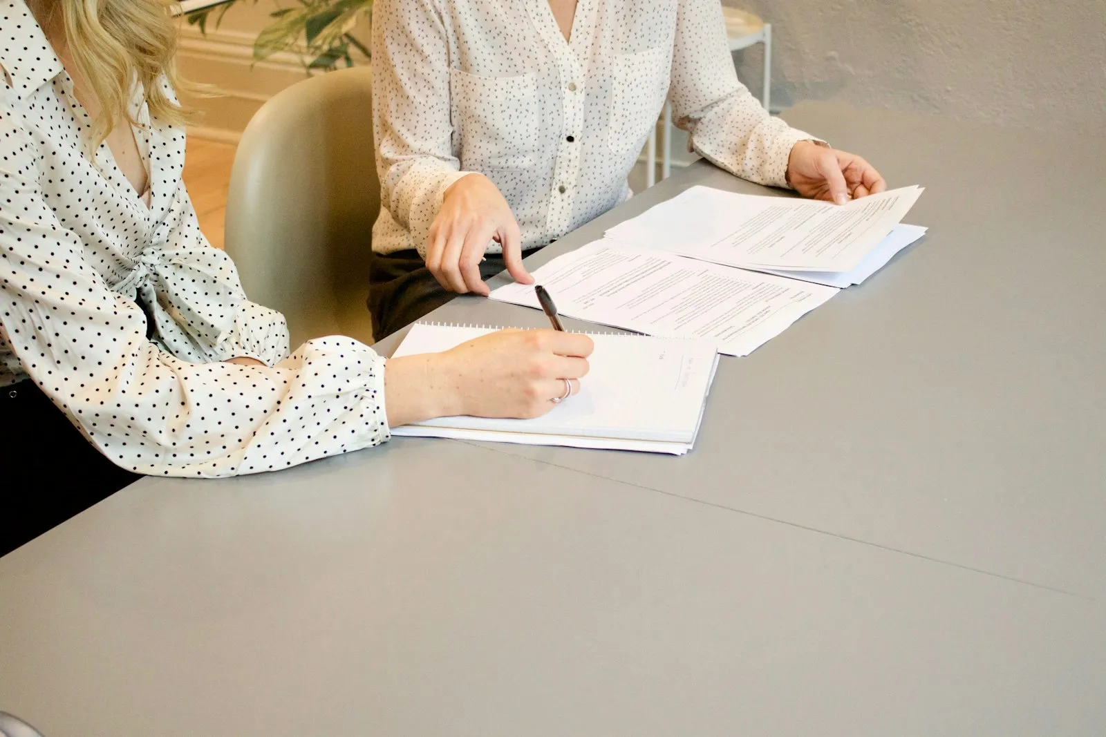 Business documents and pen on desk for SBA loan transfer