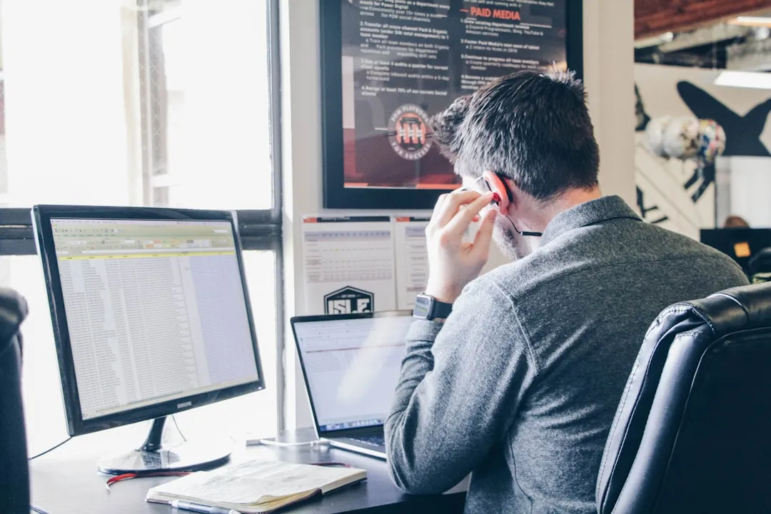 Business owner reviewing a customer list spreadsheet — tracking which agreements are at risk