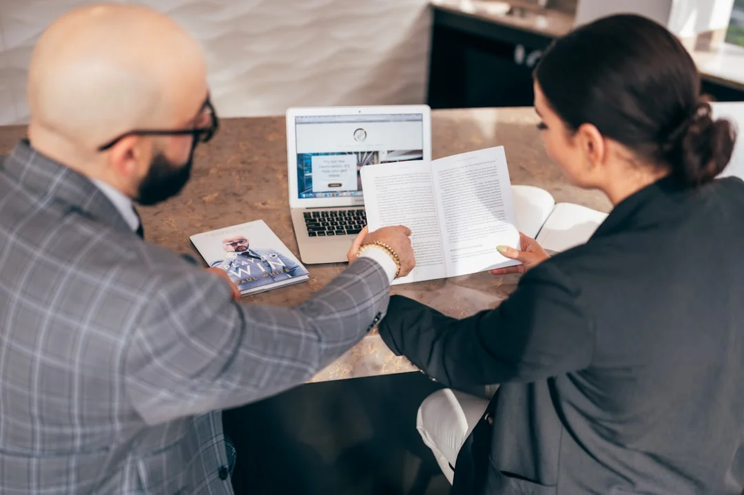 Business owner reviewing financial documents with an advisor
