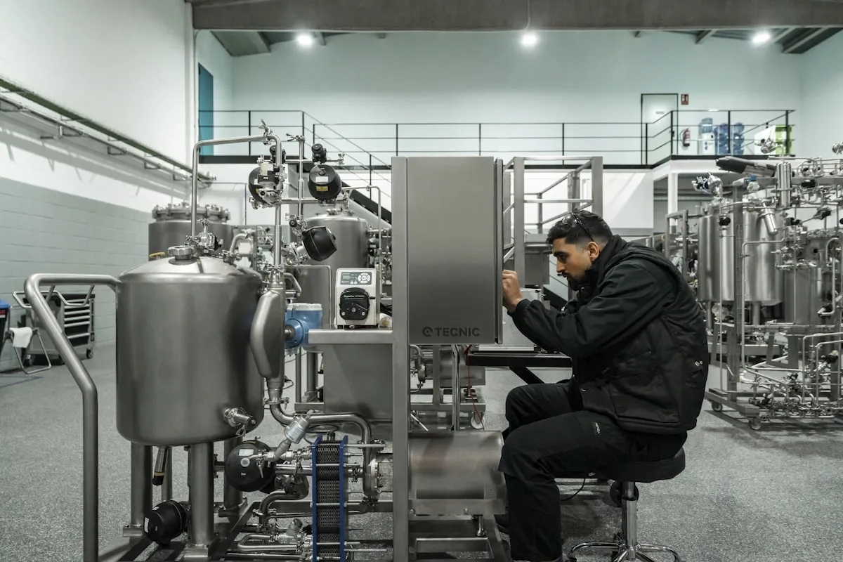 HVAC technician working on industrial mechanical systems in a commercial building