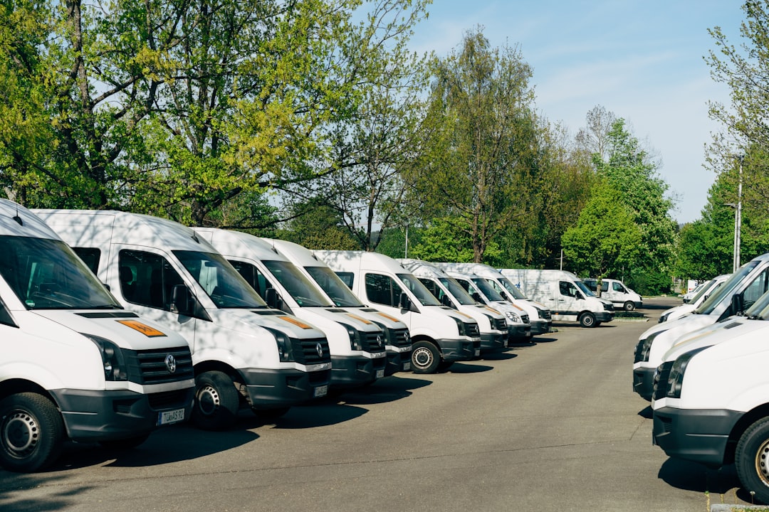 HVAC service van fleet in a company parking lot