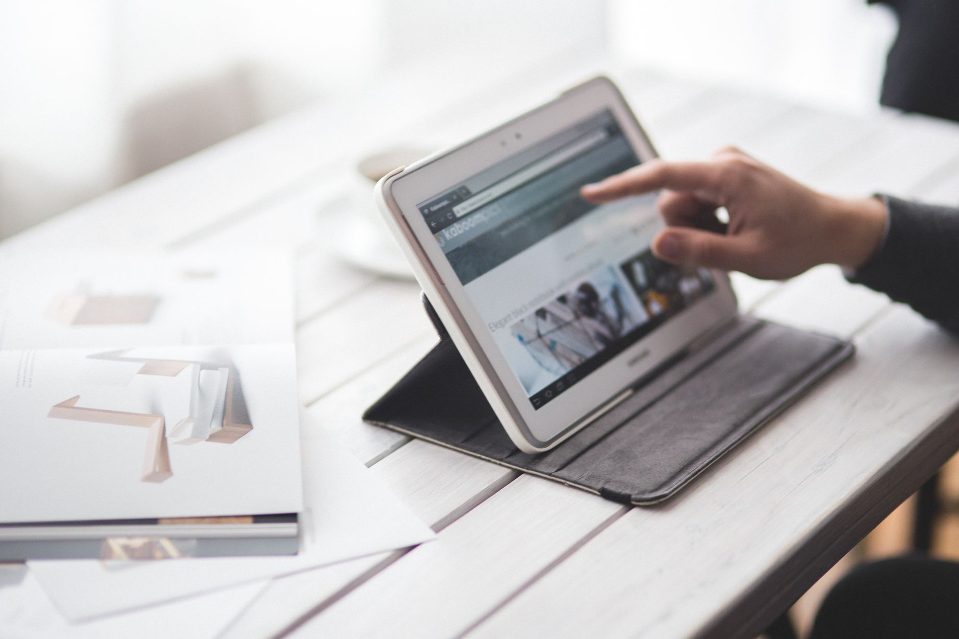 Contractor reviewing energy rebate documentation on a tablet device